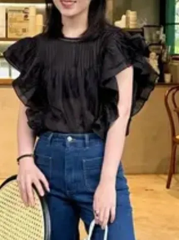 Black ruffled sleeveless top